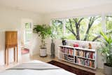 Bedroom, Bed, Bookcase, Storage, Shelves, Ceiling Lighting, and Light Hardwood Floor  Photos from Zen Light