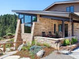 The continuation of materials from interior to exterior creates visually engaging indoor-outdoor connections.