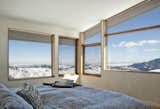 In the summer, the roof overhang shades most of the south-facing glass, while the home’s narrow profile and operable windows provide cross ventilation cooling.