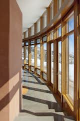 In the winter, the low sun floods the space and provides passive solar heating, absorbed by the concrete floor’s thermal mass. 