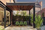 A covered cedar terrace and a green roof bookend this Annex home with outdoor living spaces.