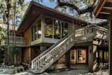 The home seems to sit on stilts, with most living spaces on a second level with cedar batten vaulted ceilings culminating on a clerestory balcony lookout