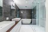 We added two master bedrooms, bathrooms a cabana bath and updated the materials throughout, all without disturbing the lush surroundings. 