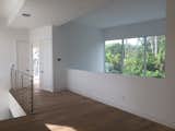 Family - TV lounge on the second floor overlooking the living -dining on the first floor
