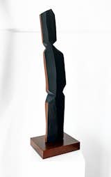 Charred and painted cedar sculpture.