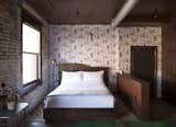 Bedroom, Bed, Medium Hardwood Floor, Floor Lighting, and Lamps  Photo 10 of 22 in Mulherin's Hotel by Daniel Olsovsky