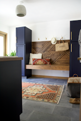A DIY Geometric Wood Wall Feature is the focal point of this side of the room.