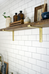 Black shelf brackets were spray painted gold.
