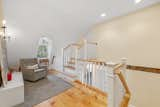 Staircase, Wood Tread, and Wood Railing Cozy sitting area.  Photo 14 of 15 in Tavern House by Debra LaPorte Communications