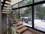 The central stair unifies the four levels of the house, while also connecting them to a large roof deck overlooking sunsets overlooking Rock Creek Park to the West. 
