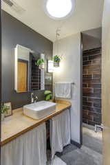 Bath Room, Pendant Lighting, Vessel Sink, Concrete Floor, Open Shower, and Wood Counter Bathroom  Photo 9 of 11 in Nashville Tiny Home by Ryan Thewes Architect