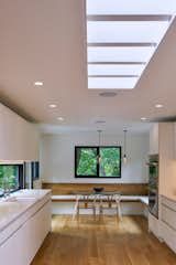 Kitchen, Recessed, Undermount, Pendant, Refrigerator, Microwave, Ceiling, White, Wall Oven, and Light Hardwood  Kitchen Light Hardwood Refrigerator White Ceiling Pendant Recessed Photos from Saxonia Residence