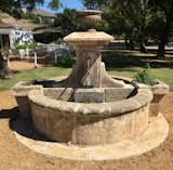 Our hand carved limestone fountain complements any style of architecture. For similar fountains check out our selection. 

https://pittetarch.com/fountains/limestone-and-iron-village-fountain.html
