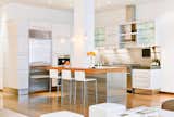 Kitchen, Dark Hardwood Floors, Range, Range Hood, Wall Oven, White Cabinets, Recessed Lighting, Undermount Sinks, Refrigerator, Ceiling Lighting, Metal Backsplashes, Concrete Counters