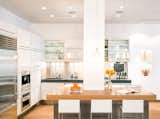 Kitchen, Dark Hardwood Floors, Range, Range Hood, Wall Oven, White Cabinets, Recessed Lighting, Undermount Sinks, Refrigerator, Ceiling Lighting, Metal Backsplashes, Concrete Counters
