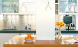 Kitchen, Dark Hardwood Floors, Range, Range Hood, Wall Oven, White Cabinets, Recessed Lighting, Undermount Sinks, Refrigerator, Ceiling Lighting, Metal Backsplashes, Concrete Counters