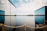 Exterior, Flat RoofLine, Wood Siding Material, Shingles Roof Material, House Building Type, Glass Siding Material, Cabin Building Type, and Prefab Building Type The unobstructed 180-degree views of the lake  Photo 2 of 7 in Nordic Maldives by ÖÖD Mirror Houses by ÖÖD Mirror Houses