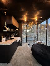 Kitchen This tiny house has heated floors, an air conditioner, a small kitchenette, and a hot tub and grill outside  Photo 3 of 13 in Luxury off-grid mirror cabins by ÖÖD near Sequoia National Park by ÖÖD Mirror Houses