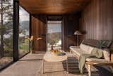 The interior and exterior cladding, terrace, and ceiling are finished in Thermory’s thermo-treated ash