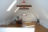 The skylights that descend into the wall plane bring in natural light and provide views of the historic neighborhood.&nbsp;