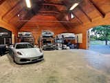 Garage How about a customized barn to house that prized classic car collection.  Barn Pros can set you up with a wide variety of packages including everything from blueprints (you could pay up to $30,000 for those alone) to lumber and hardware, ready to build—the only materials not included are nails, concrete, and the final layer of roofing.  Photo 1 of 9 in 9 Prefab Garage Solutions for Auto Enthusiasts