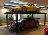 Add an extra Porsche with a custom residential car lift by American Custom Lifts, designers of the first and only American-made single post car lift for storing two vehicles in the parking space of one.