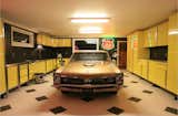 Garage and Attached Garage Room Type From beautiful carriage doors to stainless steel cabinets and antique memorabilia neon signs, Portland-based company Vault designs gorgeous spaces  Photo 12 of 14 in Garages by Donnie Thompson from 9 Prefab Garage Solutions for Auto Enthusiasts
