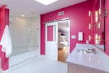 Pink heats up this renovation by Virginia-based Design Line.  Photo 7 of 11 in These 10 Designers Are Experts at Creating Colorful Bathrooms That Pop