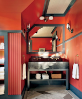 Shope Reno Wharton designer Thom Filicia splashed out in navy-and-red for this in guest bath in an Adirondacks home.  Photo 8 of 11 in These 10 Designers Are Experts at Creating Colorful Bathrooms That Pop