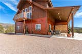 This off-grid mountain barn home located in the heart of the Rockies sits at 7,500 feet and has expansive, beautiful views of the foothills below. The model is a Barn Pros 36 ft. x 36 ft. Denali barn apartment with a partially enclosed shed roof on one side for outdoor seating and entertainment area.  Photo 8 of 11 in 10 Prefab Barn Companies That Bring DIY to Home Building