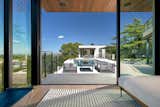 Family room view of terrace and infinity edge pool & spa