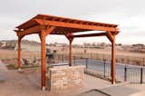 Simple and clean, or dressed up with lights, shades, and ceiling fans, redwood shade structures can be utilized any number of ways.