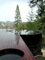 A livestock water tank re-imagined: at 25ft in diameter and 14ft deep, this pool provides a wonderfully unique body of water.  Photo credit: Lundberg Design  Photo 2 of 5 in Olle Lundberg, Architect by Humboldt Sawmill Company