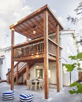 The redwood deck just off the kitchen provides a relaxing hang out spot, while the outdoor dining area underneath the redwood shade structure provides the perfect spot for al fresco dining. Photo credit: Zeke Ruelas