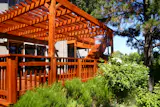 Combination redwood deck and shade structure project from Metamorphosis Landscaping. 