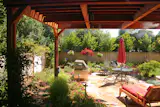 Metamorphosis Landscaping redwood pergola with a built-in mist cooling system for hot days. 