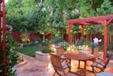 All the elements in a Metamorphosis Landscaping project work well together to create a harmonious space. This project includes redwood fencing, a redwood shade structure, and redwood latticework for climbing vines. 