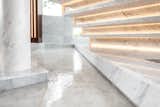 A water element on the main floor offers a sense of cohesion and serenity.  Photo 3 of 11 in Marble by Liv Interiors