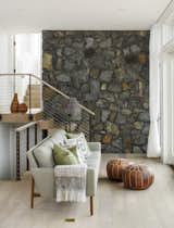 The exterior field stone wraps into the interior here, further blurring the line between indoors and out.