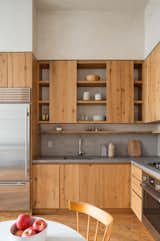 Open kitchen with reclaimed white oak cabinets with sliding doors, 