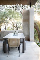 Dining Room, Bench, Limestone Floor, and Ceiling Lighting Detail View of the Alfresco Dining Area  Photo 6 of 10 in Longchamp Outdoor Living by Clark Richardson Architects