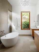 View of Principal Bath Tub Juxtaposing against Texas Lueders Limestone Floors and Walls.