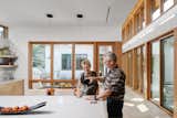 Portrait of Owners in their Kitchen Space