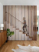 Entry vestibule featuring walnut screen element