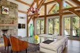 Open floor plan allows for plentiful light, unparalleled views. Hand-carved, handcrafted timbers.  Photo 7 of 16 in Contemporary Timber Frame Home Overlooking Twin Waterfalls by OakBridge Timber Framing