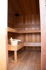 The sauna, built out of cedar wood, is designed to comfortably fit four people.