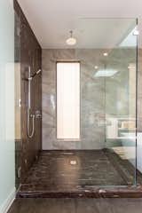 Bath Room, Quartzite Counter, Corner Shower, Ceiling Lighting, and Porcelain Tile Wall Master shower with Quartzite wall.  Photo 12 of 28 in The Abernathy