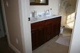 Bath Room, Porcelain Tile Floor, Full Shower, Marble Counter, and Undermount Sink Master vanity finished in mahogany.  Photo 10 of 11 in Jensen's Londonderry home by Stowell Hill Designs