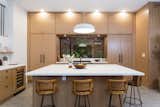 Kitchen, Wood Cabinet, Concrete Floor, Engineered Quartz Counter, Pendant Lighting, and Recessed Lighting  Photos from Example designs