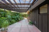 Deep eaves along the exterior create several shaded spaces for outdoor entertaining. 